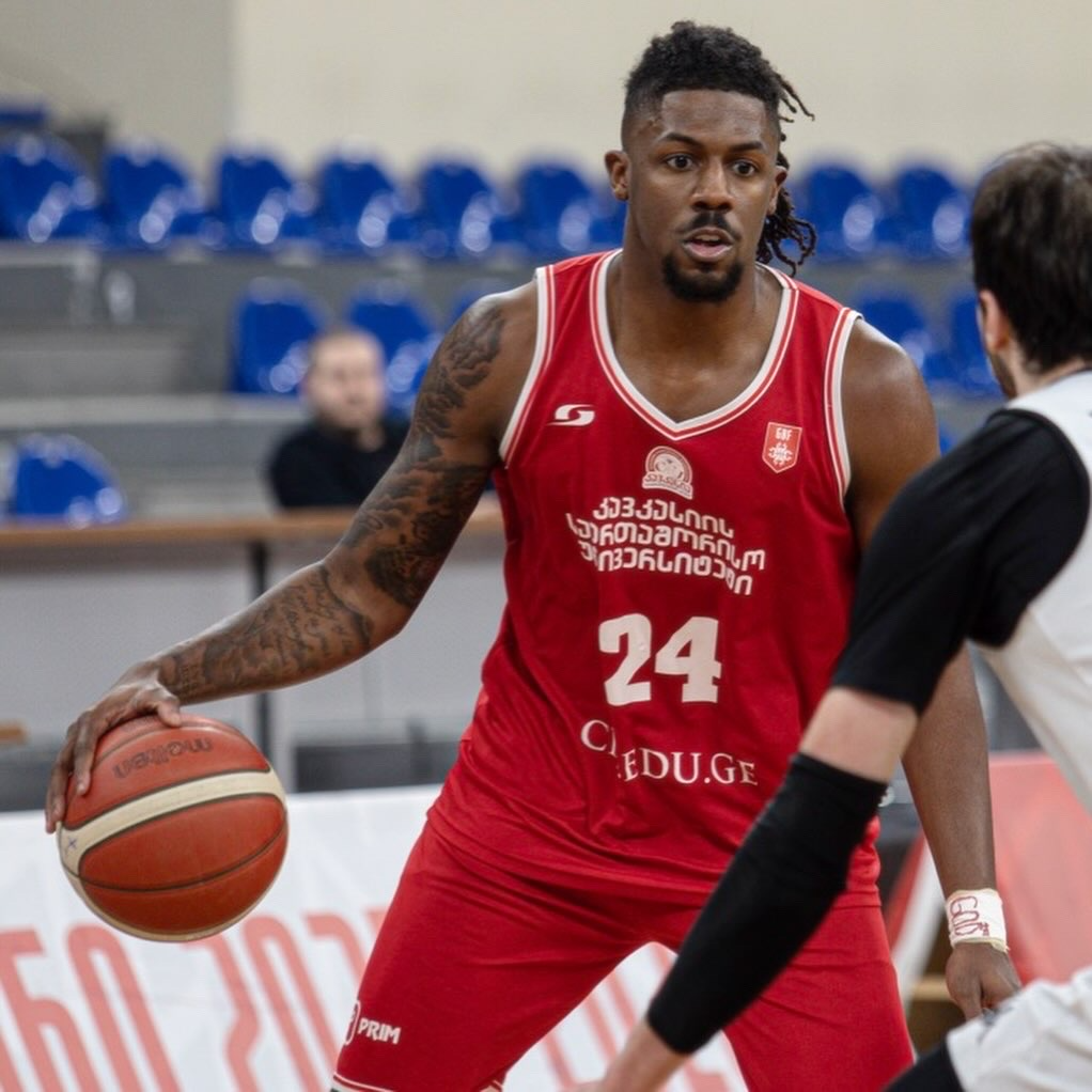 Nehemiah Benson handling the basketball during a professional game